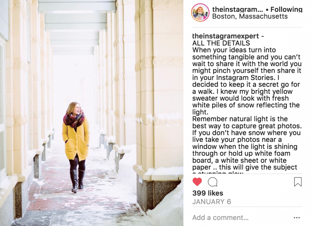 Sue B Zimmerman's Instagram post that shows her smiling as she wears a yellow jacket and walks down a snowy walkway.