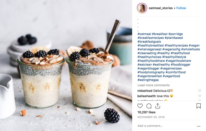 Oatmeal Stories Instagram post shows two cups of oatmeal topped with almonds and blackberries.