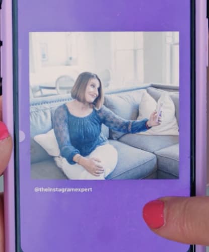 Sue B Zimmerman holds her thumb down on the Instagram post draft so the background turns purple.